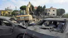 Israeli strikes in southern Lebanese village kill 11, state media say